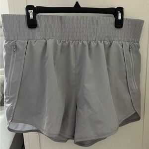 Size Large grey running shorts.